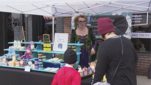 Vendor talking with customers